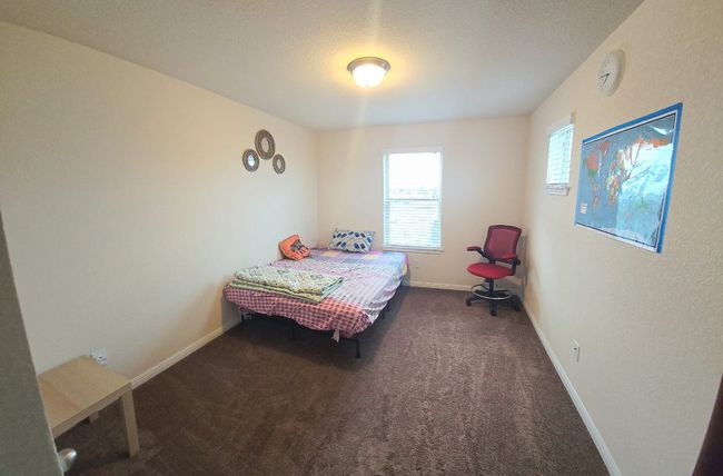 Bedroom featuring carpet floors and baseboards | Image 22