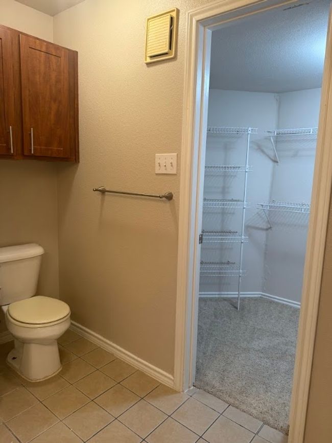 Bathroom with tile patterned floors and toilet | Image 20