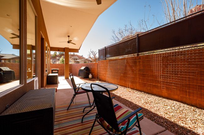 View of patio / terrace featuring a fenced backyard, ceiling fan, and grilling area | Image 5