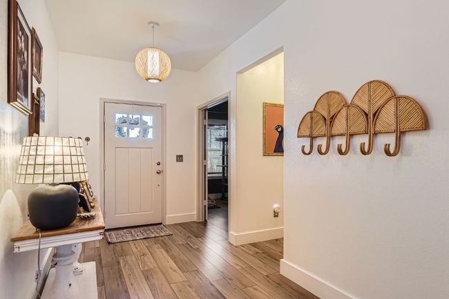 Entrance foyer with light wood-style floors and baseboards | Image 7
