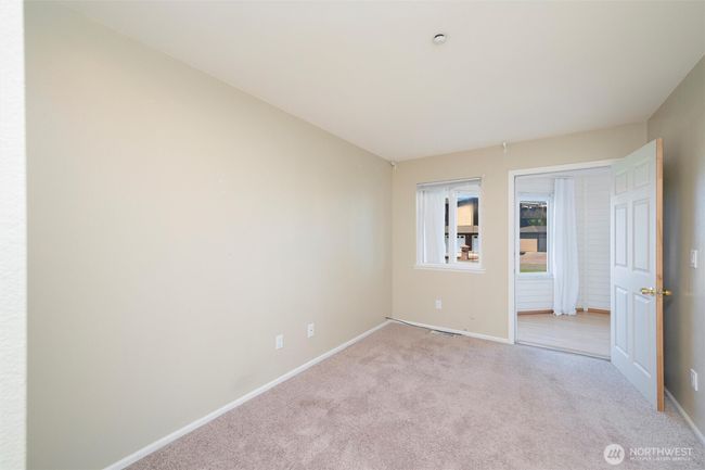 Bedroom #2 looking into sun room | Image 11