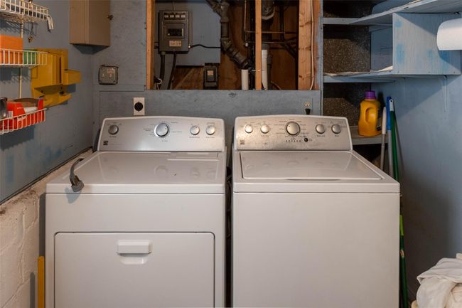 Clothes washing area featuring laundry area, washing machine and dryer, and electric panel | Image 21