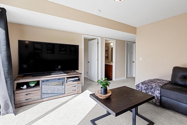 Walk-out basement features additional bedroom and 3/4 bathroom + laundry/utility room and under-the-stairs storage room. | Image 25
