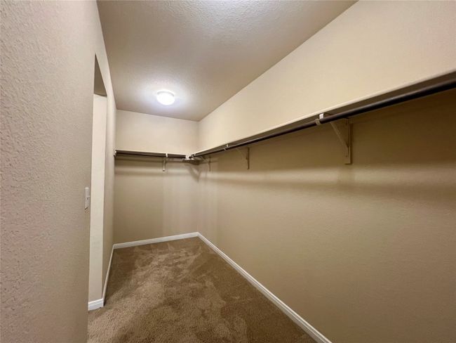 Spacious closet featuring carpet floors | Image 18