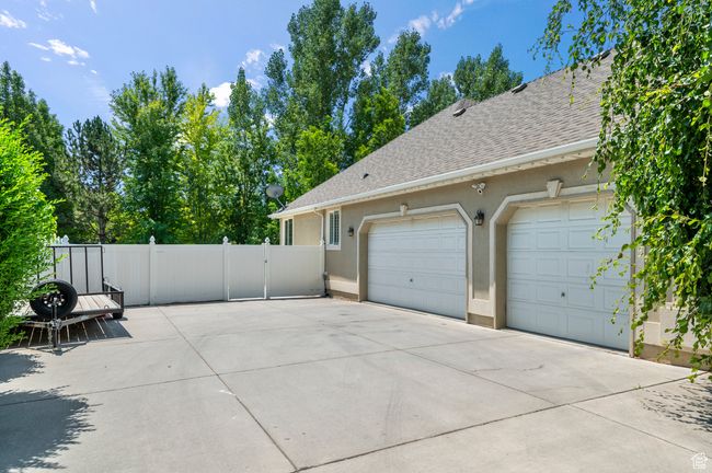 Garage featuring concrete driveway | Image 42