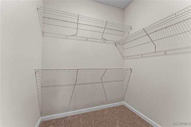 Walk in closet with carpet | Image 36