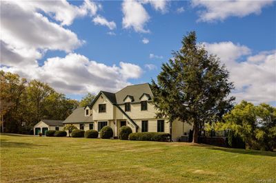 View of front of house with a front yard and cooling unit | Image 2