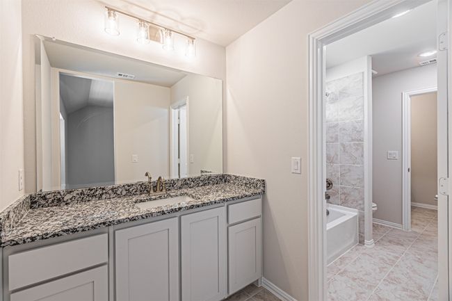 Bathroom with vanity and shower / tub combination | Image 39