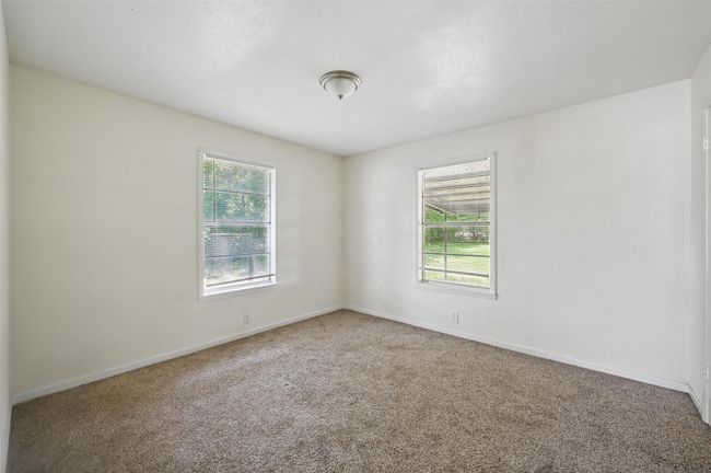Carpeted empty room with baseboards | Image 8