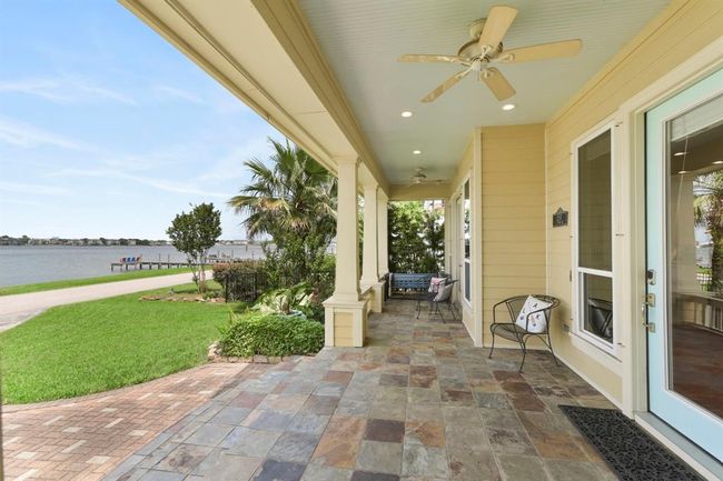 Relax on the front porch, perfect for sunsets, fireworks, and enjoying your favorite drink. | Image 8