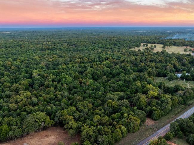 Aerial view at dusk with a wooded view | Image 11