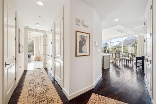 A view from the front door peaking into the second bedroom and looking out to the living area | Image 4