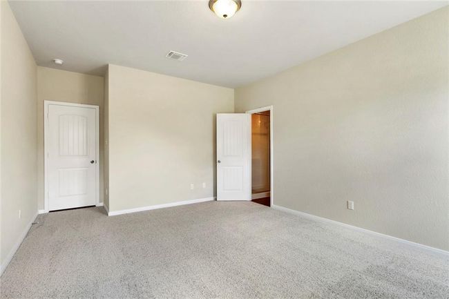 Unfurnished bedroom featuring carpet flooring and baseboards | Image 13