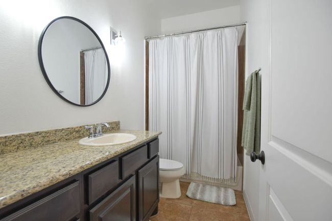 Full bath with toilet, tile patterned floors, and vanity | Image 19