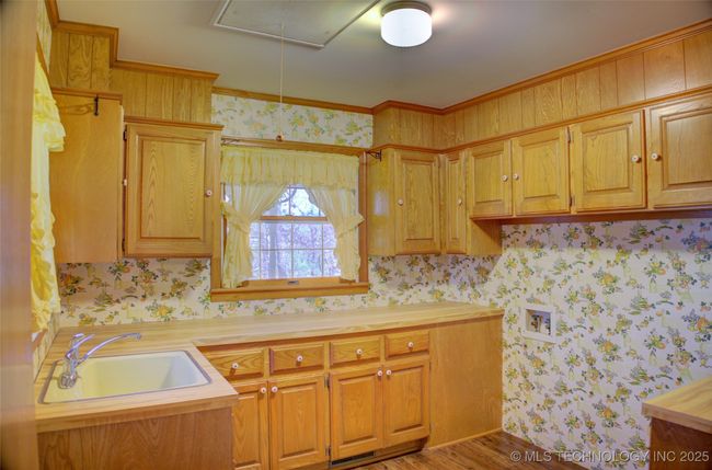 Large laundry room with sink and a spot for 2nd fridge | Image 32