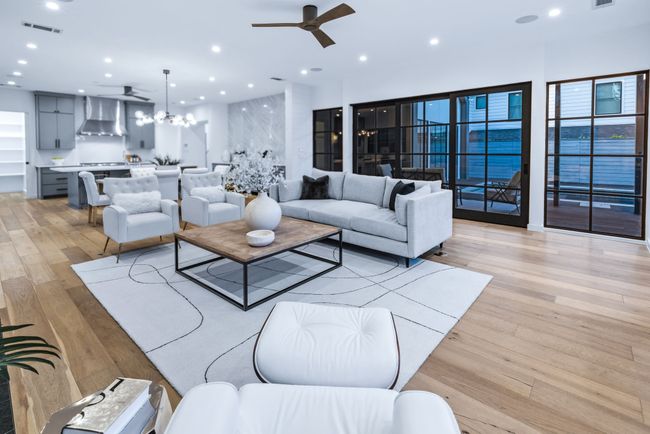 Living room featuring ceiling fan, light wood-style flooring, and recessed lighting | Image 17