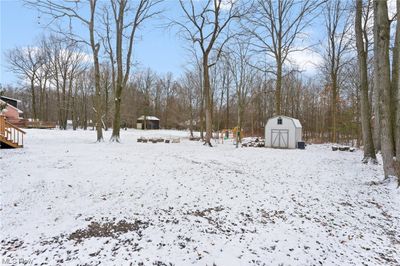 Yard featuring a shed and firepit | Image 3