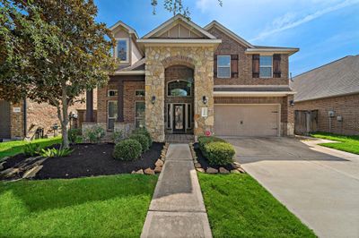 Discover the charm of this beautiful home! Be greeted by this stunning stone entrance! | Image 1