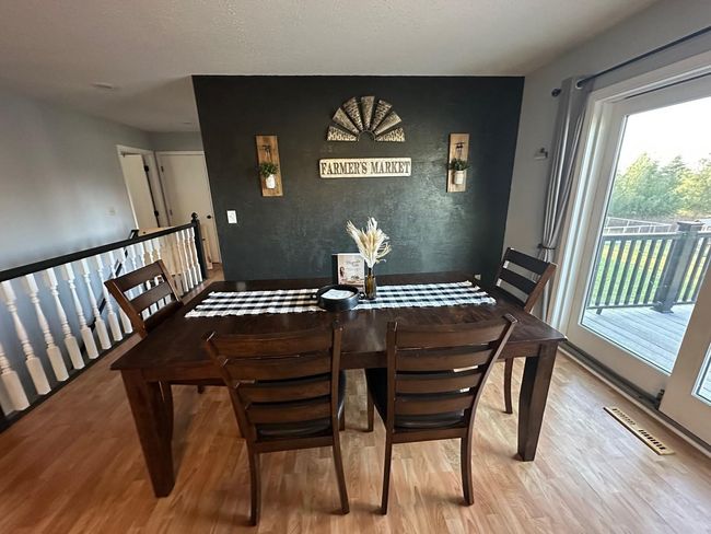 Dining room with walkout to large back deck | Image 8