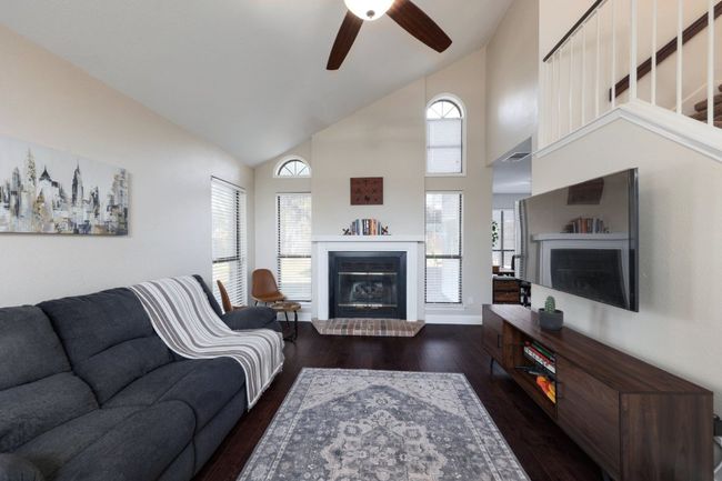 The cozy fireplace adds a touch of warmth, turning this space into the ideal spot for movie nights, casual hangouts, or just enjoying a quiet evening with a book | Image 5