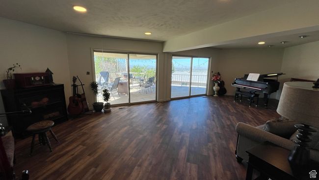 Living room with recessed lighting, baseboards, and wood finished floors | Image 14