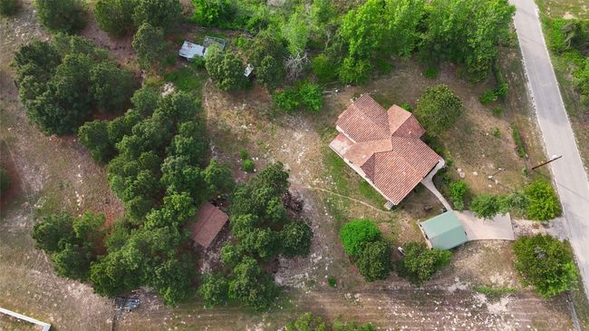 Lot is aprtially cleared, but also has many mature trees | Image 26