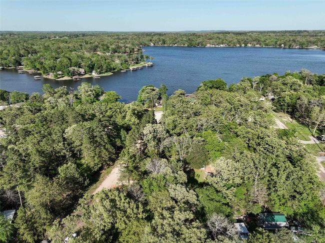 Birds eye view of property featuring a water view and additional treed lots that come with the property (5 in all) | Image 8