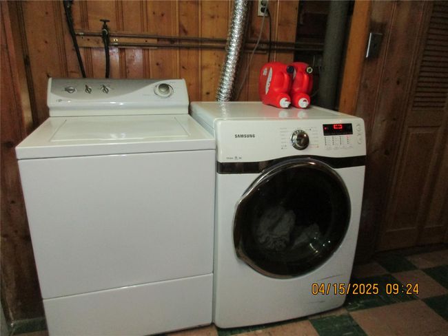 Laundry area featuring washing machine and dryer and laundry area | Image 22