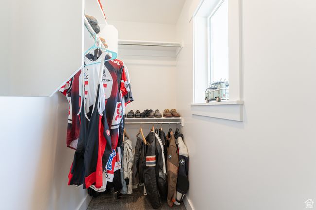 Walk in closet with carpet floors | Image 14