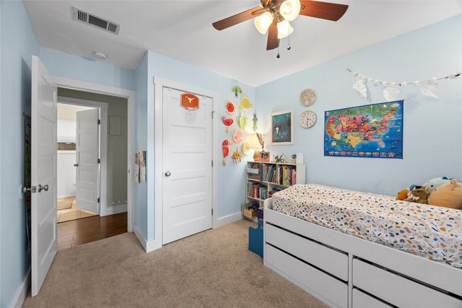 Bedroom with carpet flooring and ceiling fan | Image 11