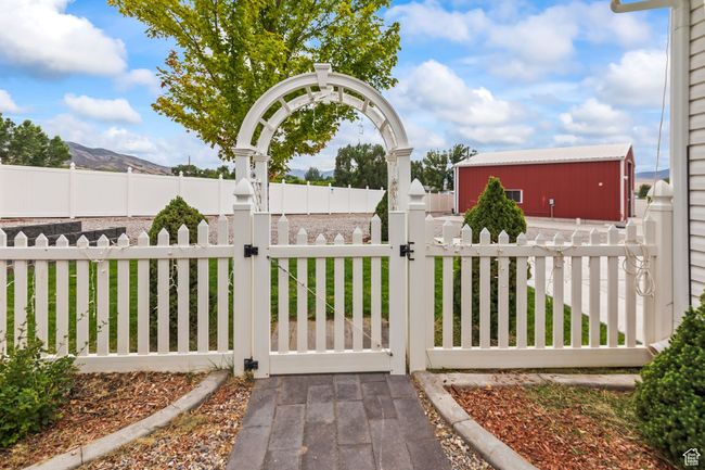Gate featuring a fenced front yard and a mountain view | Image 101