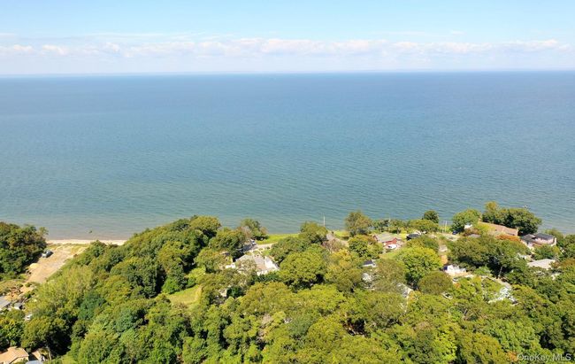 Aerial view of property and surrounding area featuring a large body of water | Image 26