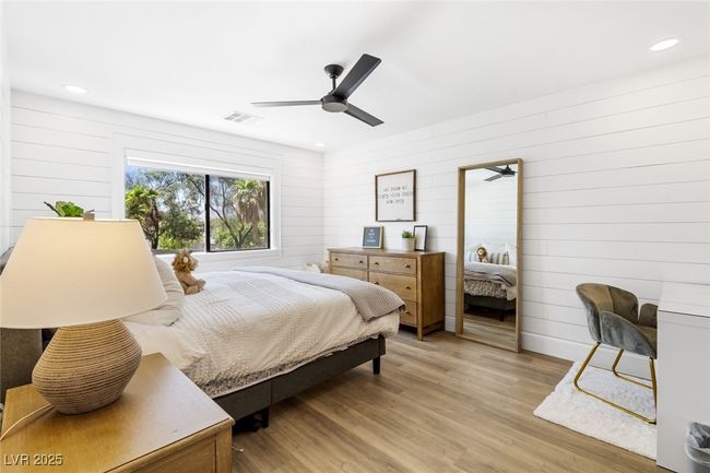 Bedroom with light wood-style flooring, visible vents, and recessed lighting | Image 30