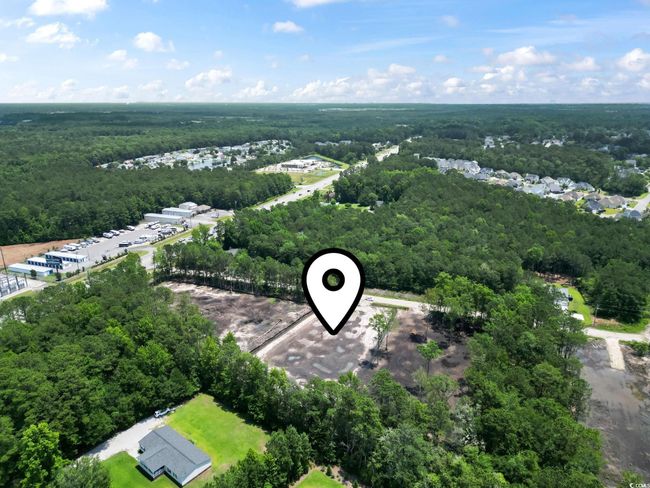 Aerial view of a heavily wooded area | Image 6