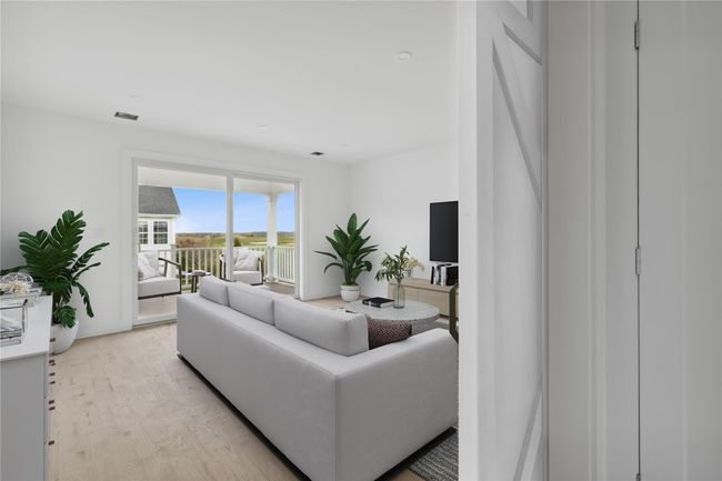 Living room with light wood finished floors and visible vents | Image 15