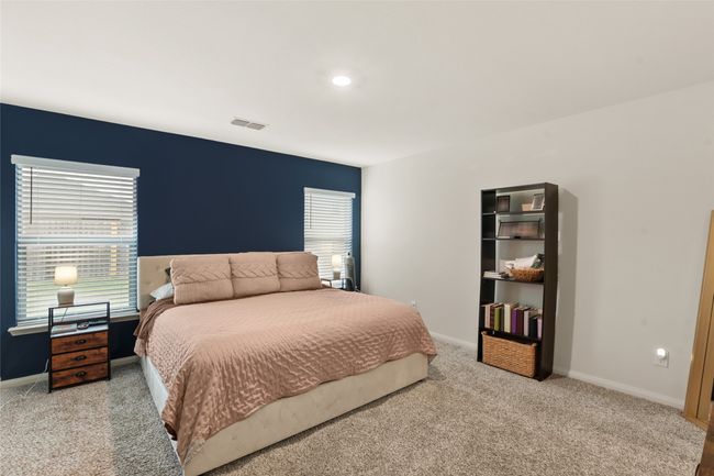 Carpeted bedroom multiple windows | Image 14