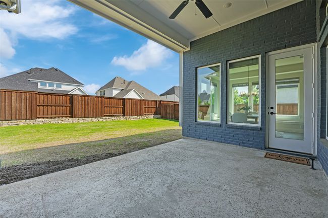 View of patio / terrace with a fenced backyard and ceiling fan | Image 38