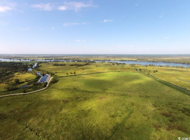 Drone / aerial view with a water view and a rural view | Image 17