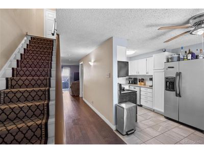 13993 E Jewell Ave, Home with 3 bedrooms, 3 bathrooms and null parking in Aurora CO | Image 2