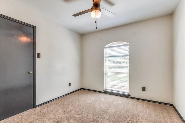 Carpeted spare room featuring ceiling fan | Image 17