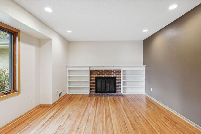 Built in book cases around fireplace. | Image 11