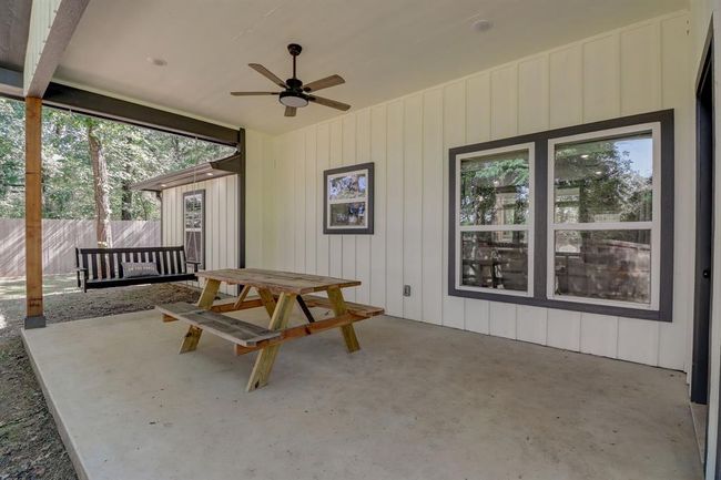 Spacious covered patio at rear of home | Image 32