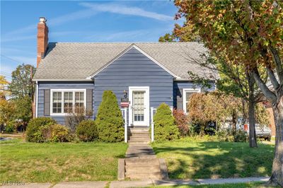 Cape Cod-style home featuring a front lawn | Image 1