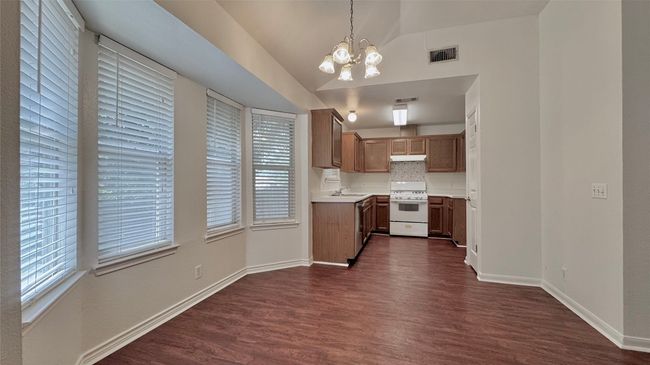 Bay window in breakfast area allowing ample natural light in | Image 7