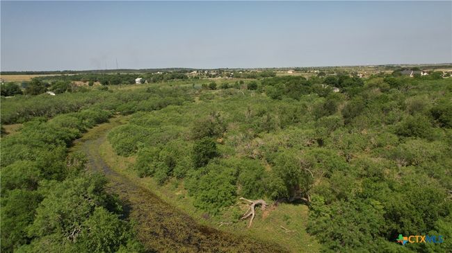 2nd stock tank located near the back of the tree grove. | Image 6