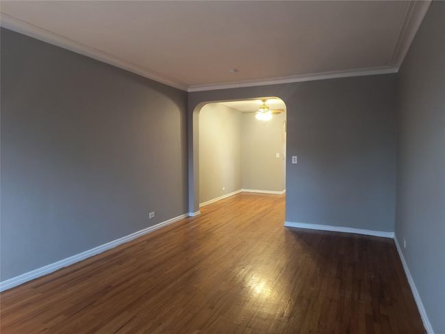 Spare room with baseboards, arched walkways, and ornamental molding | Image 19