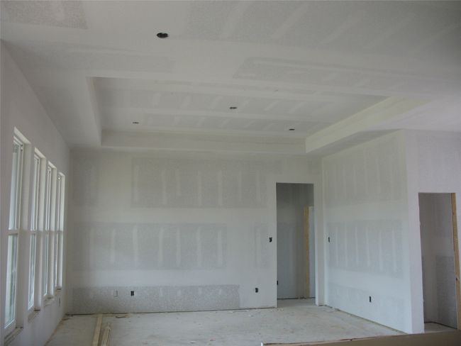 Empty room featuring a tray ceiling | Image 14