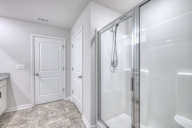 View of shower back to Bedroom door. | Image 17
