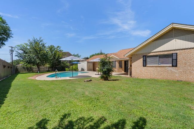 Fenced backyard featuring a patio area | Image 29