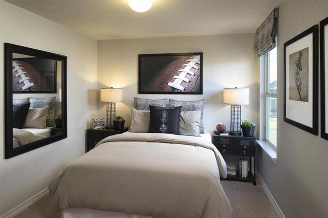 Bedroom featuring carpet, multiple windows, and baseboards | Image 40